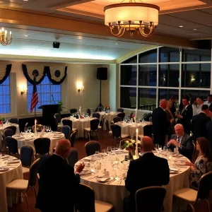 Attendees at a dinner event at a yacht club discussing military matters.