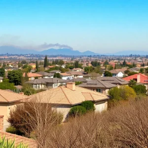 A view of a San Diego neighborhood highlighting wildfire risk with dry vegetation.