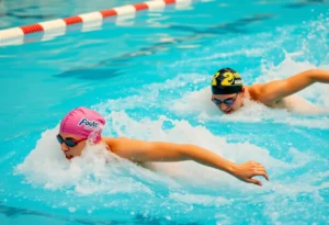 Swimmers from SDSU competing in a dual meet at the pool